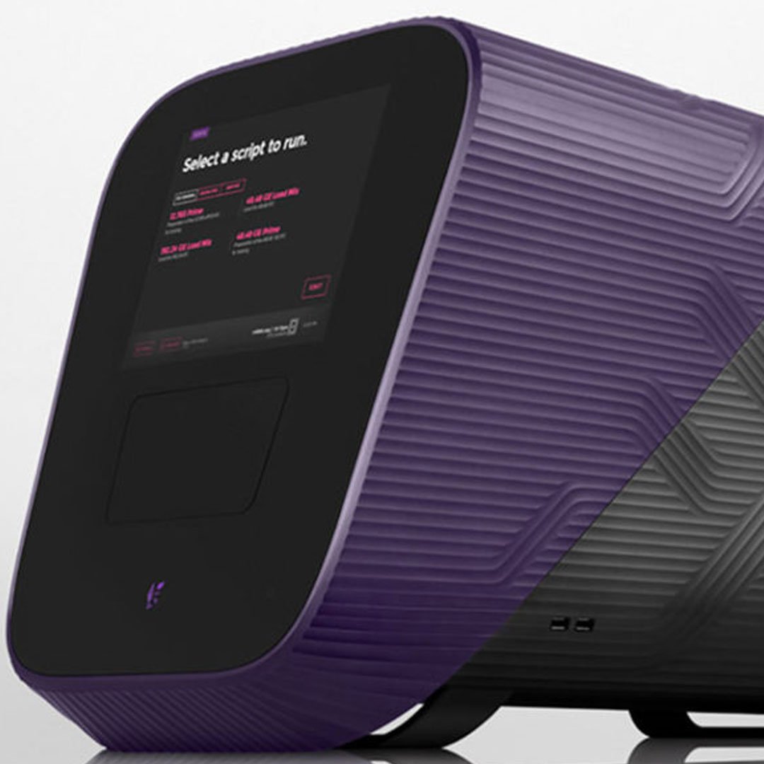 A purple and black Fluidigm lab instrument, its built-in touchscreen showing a script selection screen